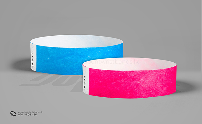light blue and pink solid colour paper hand bands / wristbands